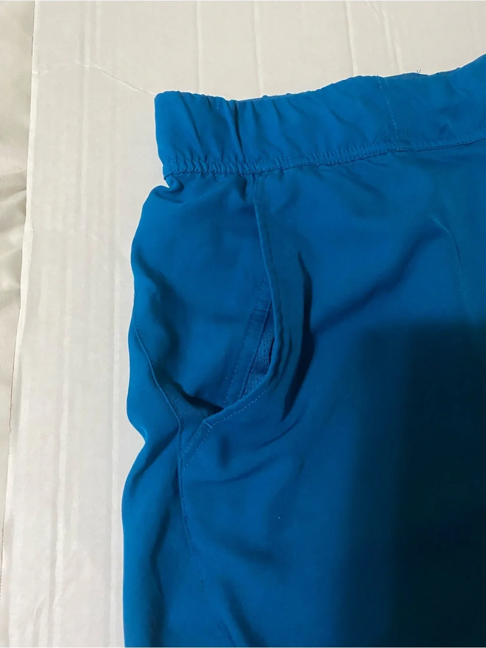 Nike Men's Bright Teal Athletic Shorts with White Swoosh
